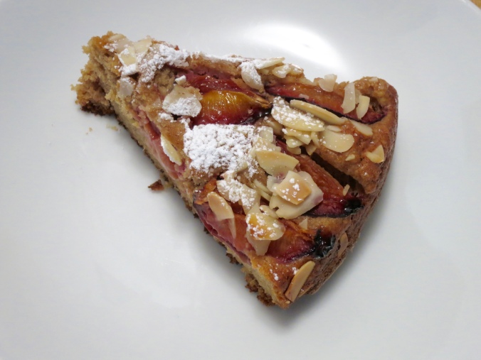 Slice of almond and plum cake